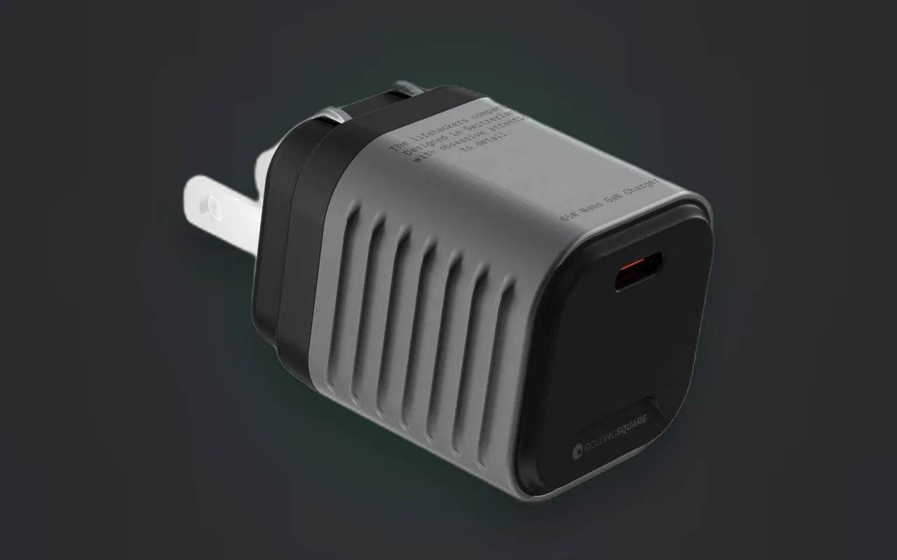 Side view of the Supertiny's ribbed GaN shell on a dark background.
