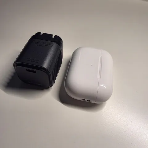Reviewer's photo: Supertiny beside an AirPods case