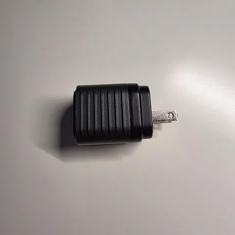Reviewer's photo: Supertiny with prongs out on a white desk