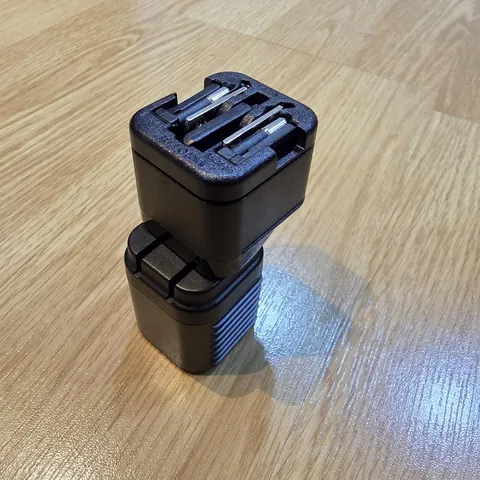 Reviewer's photo: Supertiny stacked on top of another charger